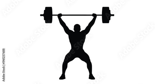 Weightlifter successfully completing a snatch lift dramatic black silhouette