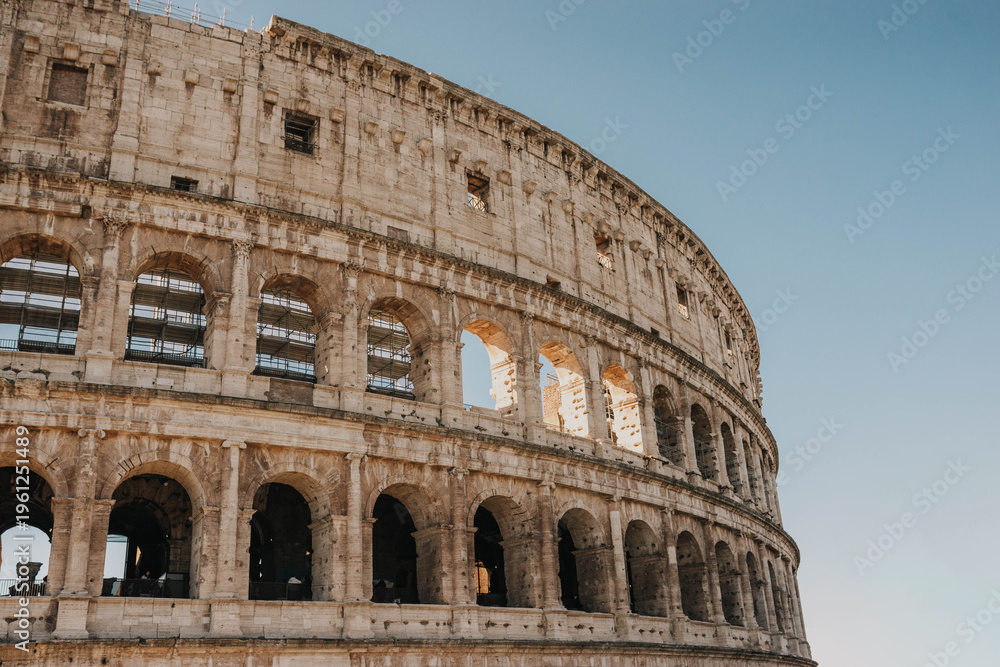 Fototapeta premium Ancient Roman Colosseum Interior Under Bright Sunny Sky, Italy