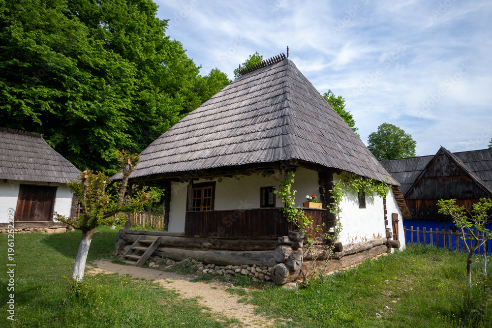 Fototapeta premium Astra National Museum Complex in the city of Sibiu, Romania. Picture of an old Romanian village with old dilapidated houses.