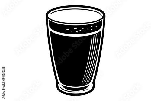Tall pint glass filled with dark beverage on white background