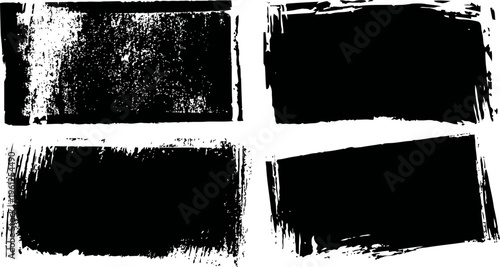 Four black grunge brush stroke textures with rough and uneven edges in rectangular shapes
