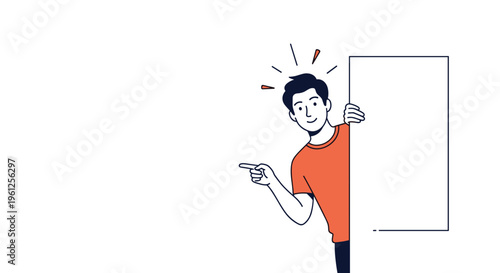 Cheerful young man wearing an orange shirt peeks from behind a blank white board and points toward empty space.