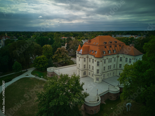 Aerial view of Lesnica Castle in Wroclaw, Poland. Baroque palace landmark under cloudy overcast sky.