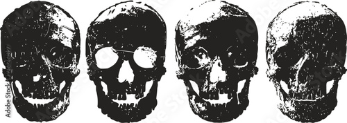 Four antique human skulls with worn textures in monochrome artistic