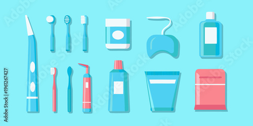 Collection of colorful dental hygiene products arranged in a flat lay