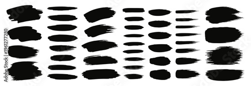 Collection of assorted black brush strokes and shapes on a white background