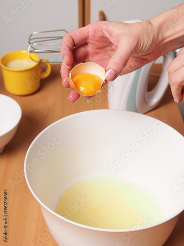 Separating egg yolk from white. Making pastry dough. Making torte with buttercream filling and grated chocolate topping. Series.