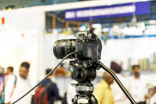 Canvas Print A DSLR with a Tether cable on tripod