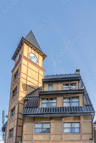 Fotografie quaint traditional building with wall clock tower,  Ushuaia, Argentina
