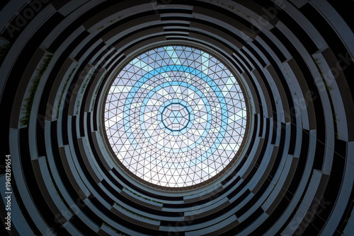 Tableau sur toile Circular skylight with geometric glass dome and blue sky