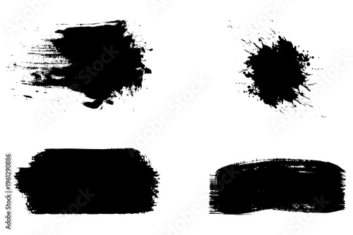 Four different black paint smears on a white surface