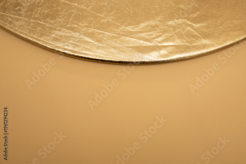 Golden round frame metallic background with luxury copy space