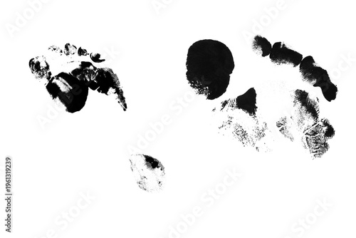 Black ink baby footprint and messy handprint impressions isolated on white