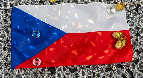 Crystal adorned Czech national flag lying on diamond pile with hops for traditional brewery and glass making.