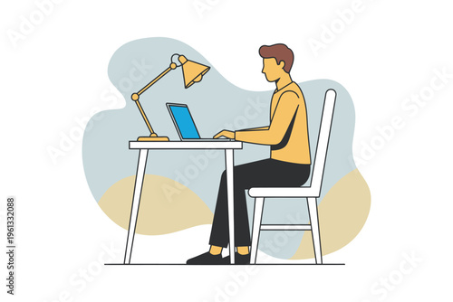 A person works on a laptop at a desk with a yellow lamp