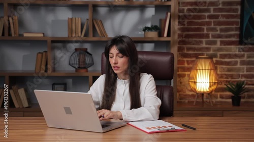 Business woman plans next steps for project goals in office.