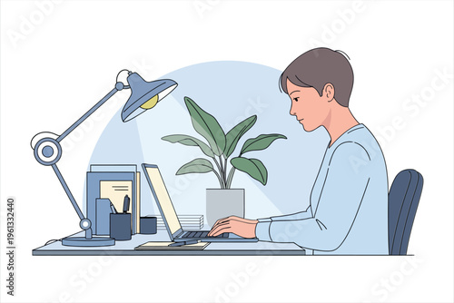 A young man works on a laptop at a desk with a lamp
