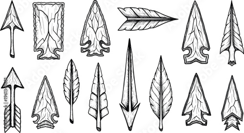 A collection of various arrowheads and feathers for hunting and historical purposes