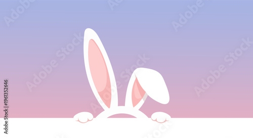 Cute bunny ears peeking over a white surface with a soft gradient background