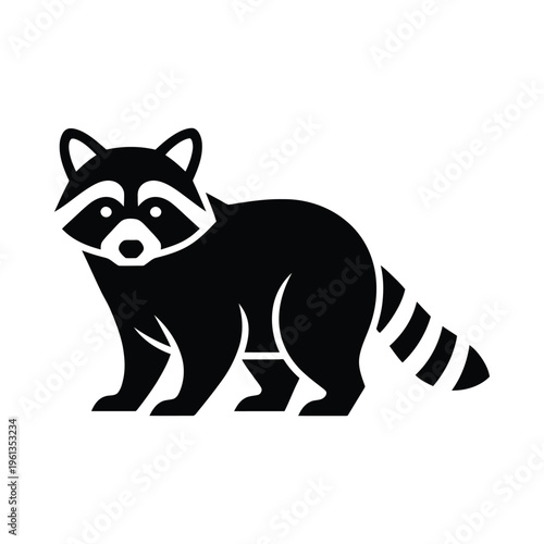 A black and white raccoon standing upright on its hind legs