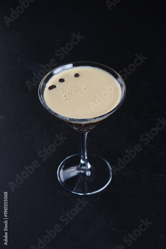 Alcoholic cocktail on a black background