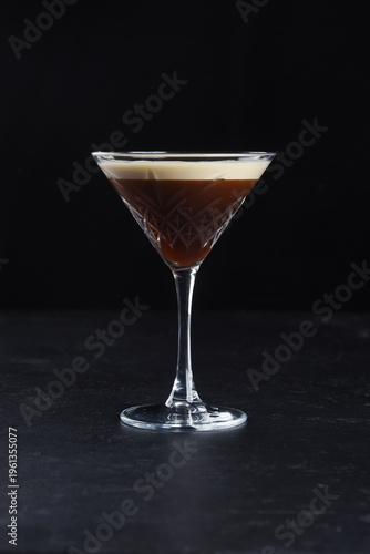 Alcoholic cocktail on a black background