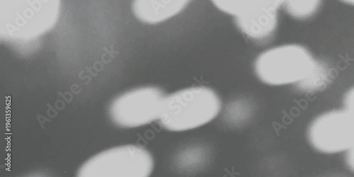 Abstract background featuring soft out of focus bokeh light spots on a dark grey textured surface Vector, illustration