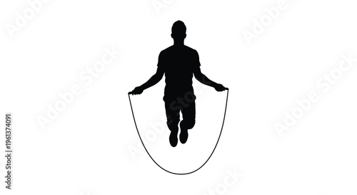 A person jumping rope in a stark black silhouette