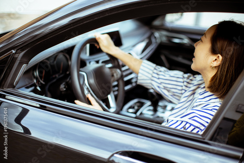 Korean woman driving a car ...