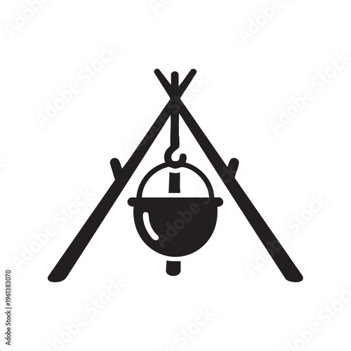 A pot hangs over a campfire from a tripod in a wilderness setting at night.