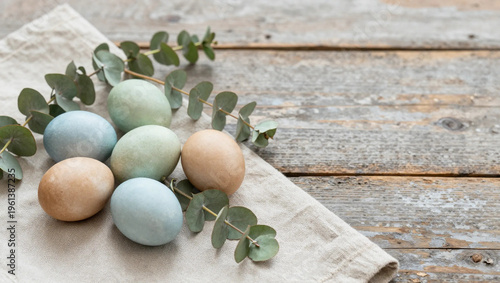 Minimal Easter Composition with Natural Dyed Eggs, Linen, and Eucalyptus