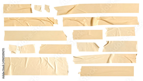 A close-up of aged, torn, and layered pieces of adhesive tape arranged against black