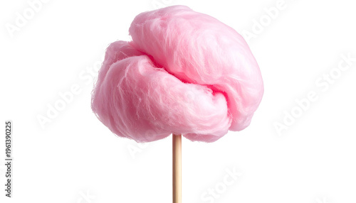 Fluffy pink spun sugar treat on a wooden stick, isolated against a solid black background