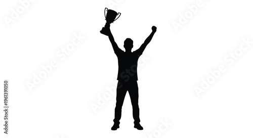 Victorious athlete celebrates with a trophy in stark silhouette