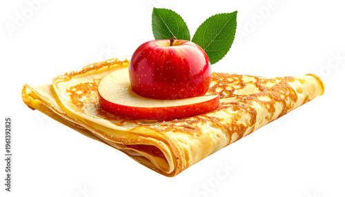Golden crepe with a red apple slice and whole apple, topped with green leaves, isolated