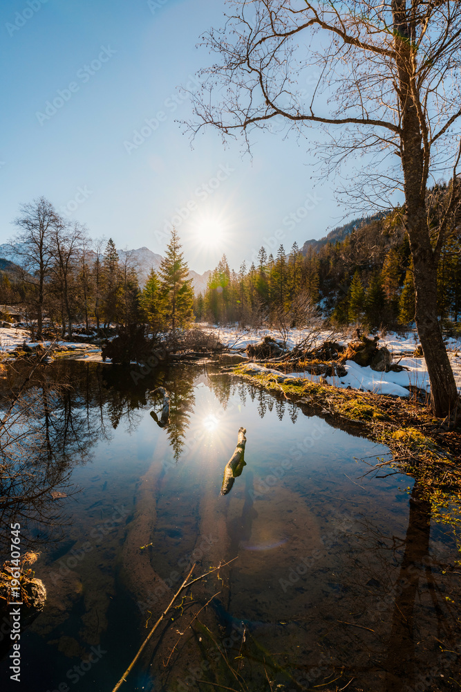 Obraz premium Mountain view with hiking path in Javorova dolina nature reserve during a winter sunny day in Slovakia in High Tatras mountains