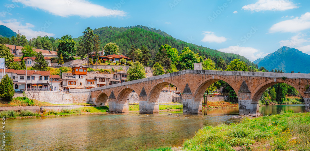 Fototapeta premium Old Stone Bridge (Stara Cuprija) over the Neretva River in Konjic, a masterpiece of Ottoman architecture, Bosnia and Herzegovina.