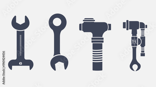 A collection of four mechanic tools in silhouette on a plain white background
