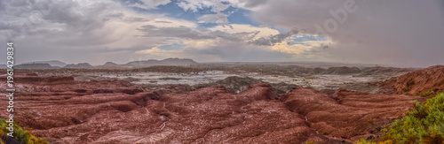 Heavy rainstorm over Flattops section of Petrified Forest National Park in Arizona captures falling rain in landscape