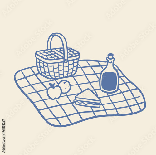 Picnic basket with food and drink items resting on a checkered blanket.