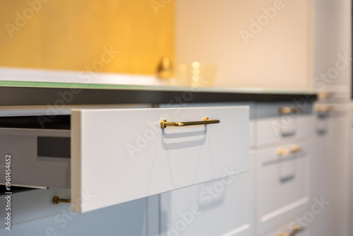 Schilderij op canvas Open kitchen drawer in modern kitchen close up