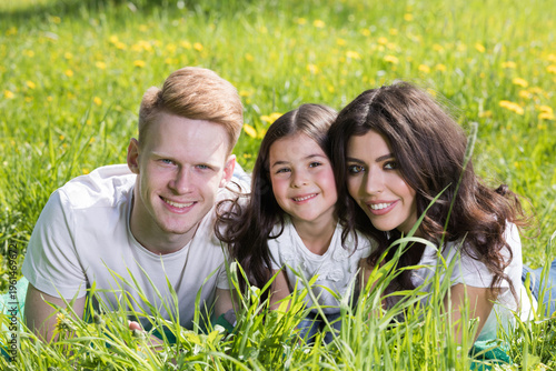 A very happy family on the green grass