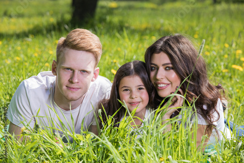 A very happy family on the green grass