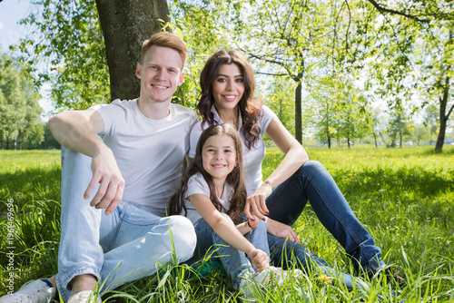 A very happy family on the green grass