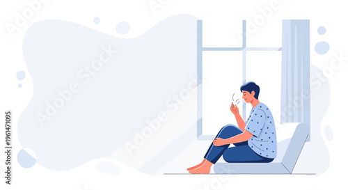 Young man sitting by the window, feeling unwell, looking at his hand