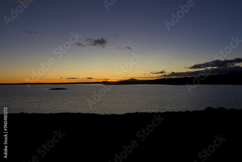 Sunset over calm reservoir