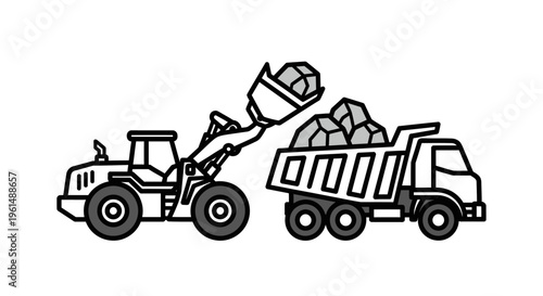 Heavy machinery loading a truck.