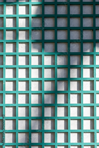 Traditional Korean wooden window lattice pattern with paper screen and soft shadows