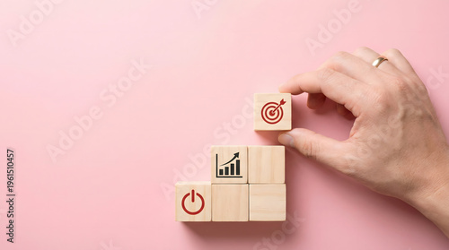 Hand placing wooden block with target icon on stairs, business growth concept