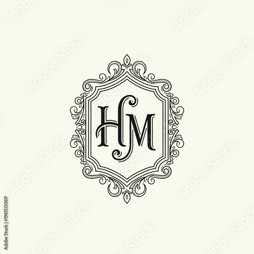 Elegant HM Monogram in Ornate Vintage Frame Design.